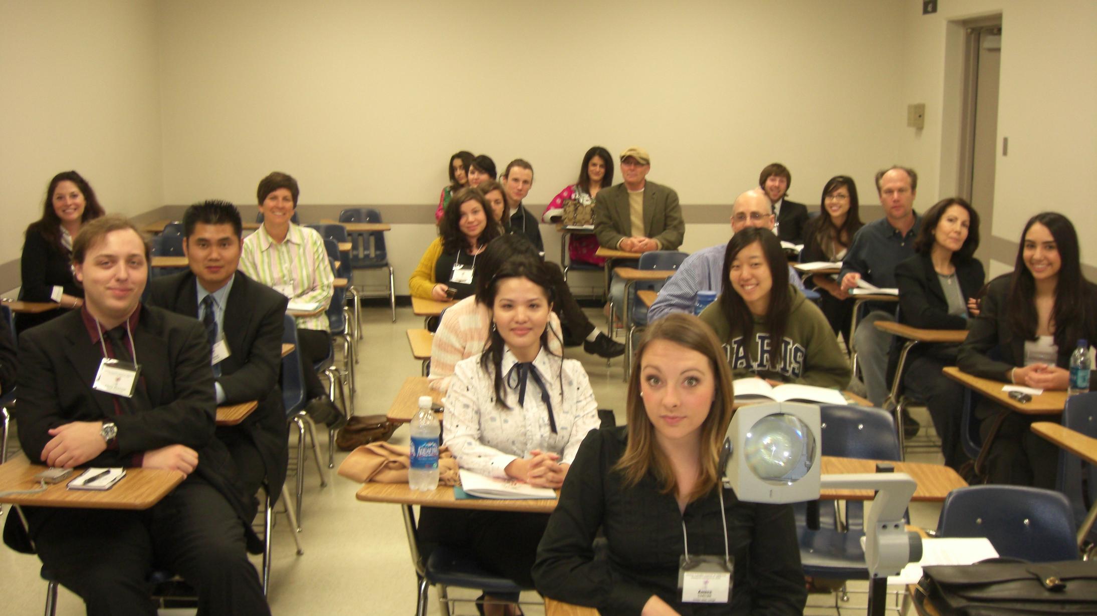 students from different California colleges converging to listen to one of the individual conference presentations
