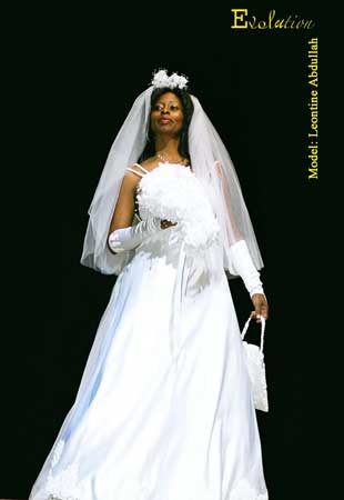 Classic white wedding dress with veil, bouquet, gloves, purse & shoes.