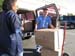 Arnold the Re-use Tech, helps bring boxes into dialysis center.