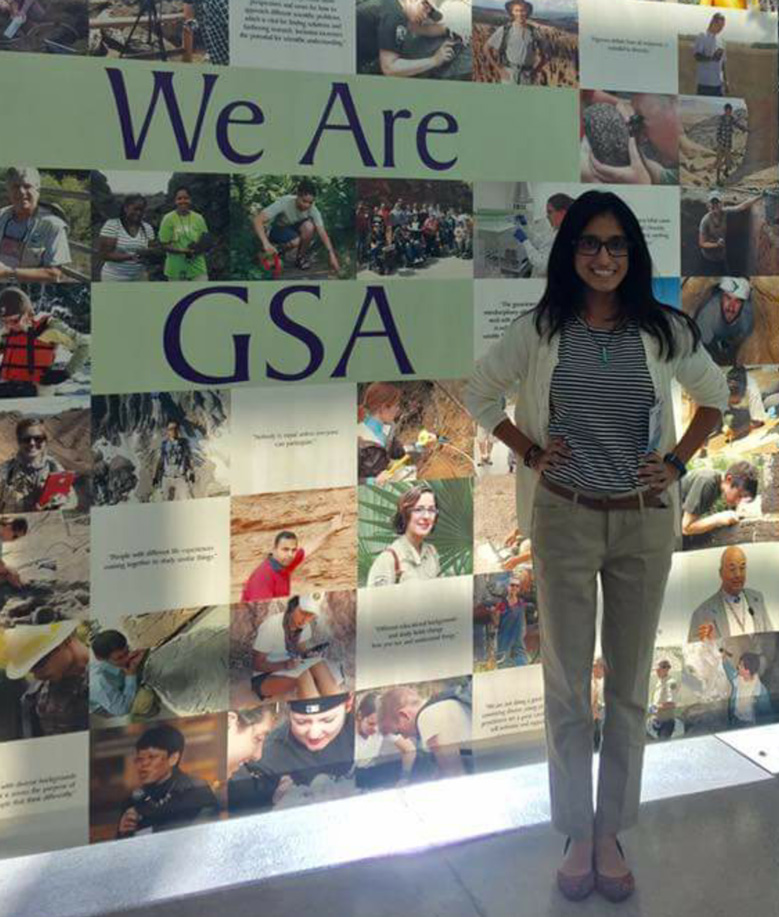 Javaria Aziz in front of her geology presentation