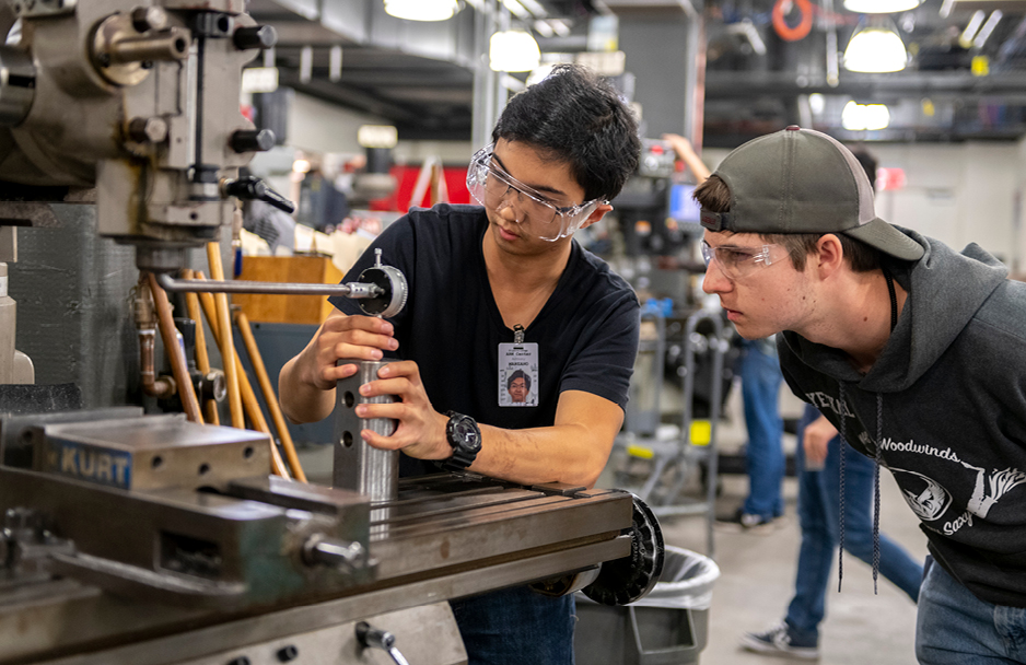 Students using machinery