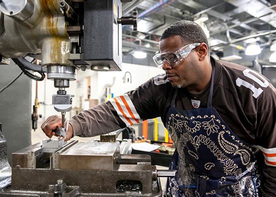 Student working with machine