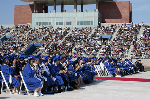 Grads and audience at commencement