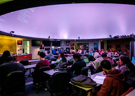 Students in the planetarium during class