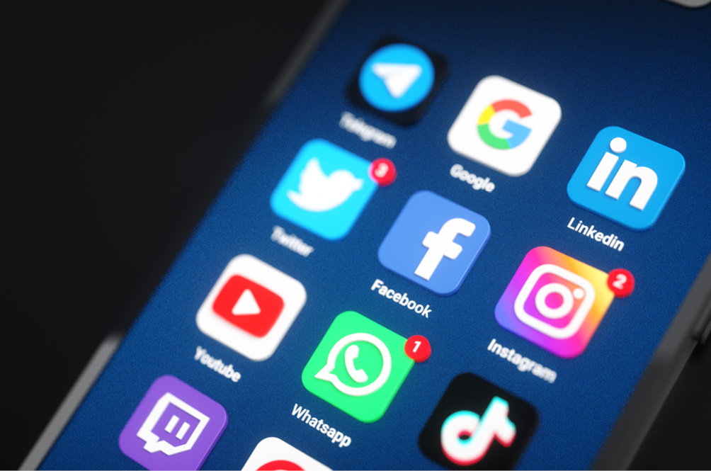 Social media icons displayed on a cell phone.