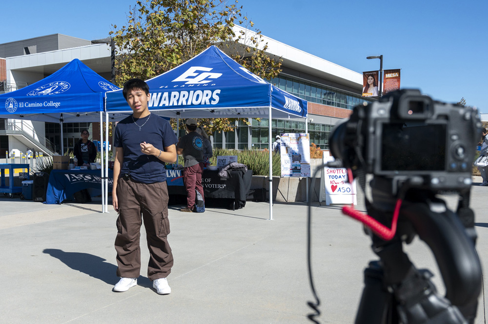 Social ambassador filming on campus.