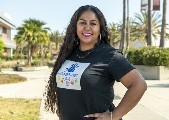 El Camino student Maria Lopez poses in front of the Behavioral and Social Sciences Building at El Camino College on a late sunny afternoon.