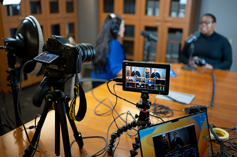 Behind the scenes photo of podcast recording.