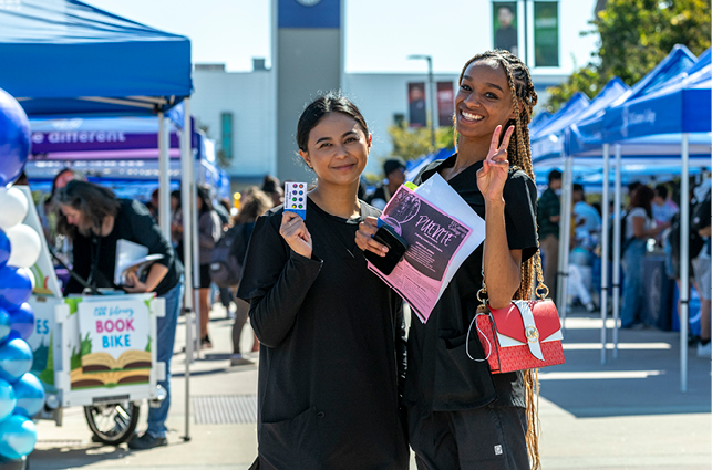 Students smiling at the Student Support Expo