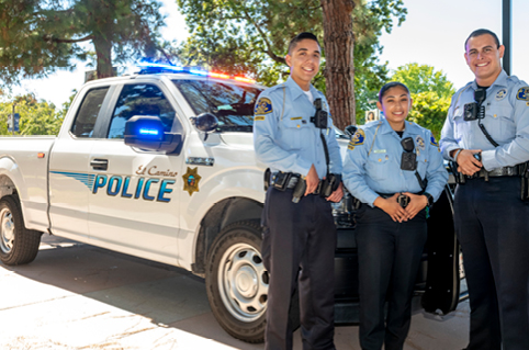 Police cadets standing in front of the El Camino police truck