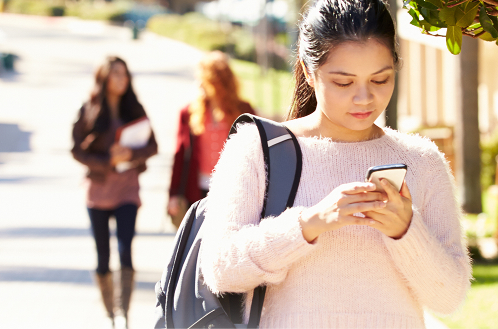 Female student looking at her phone.