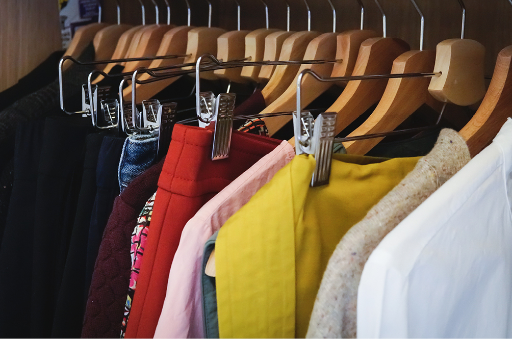 Clothes on hangers.