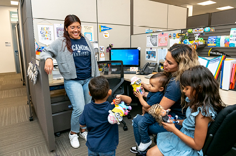 CARE student and her children with staff.